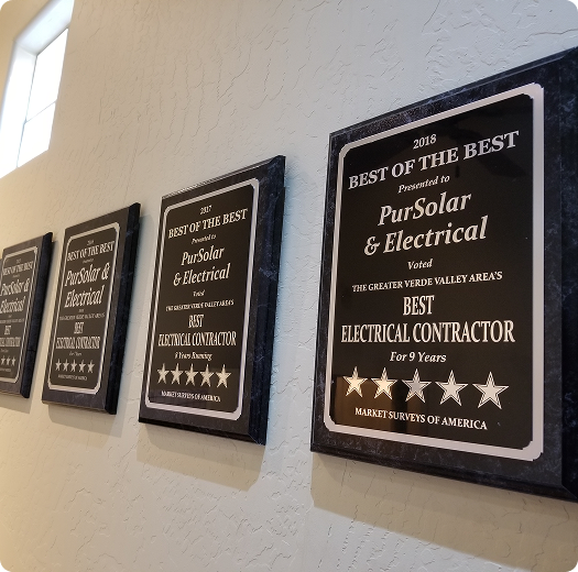 award plaques on the wall showing they won awards multiple years in a row